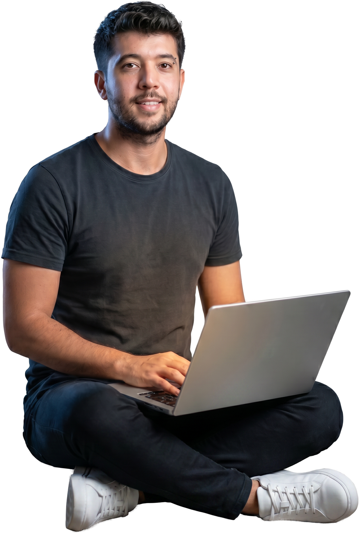 Muhammed Uygur, a creative developer, working on a laptop